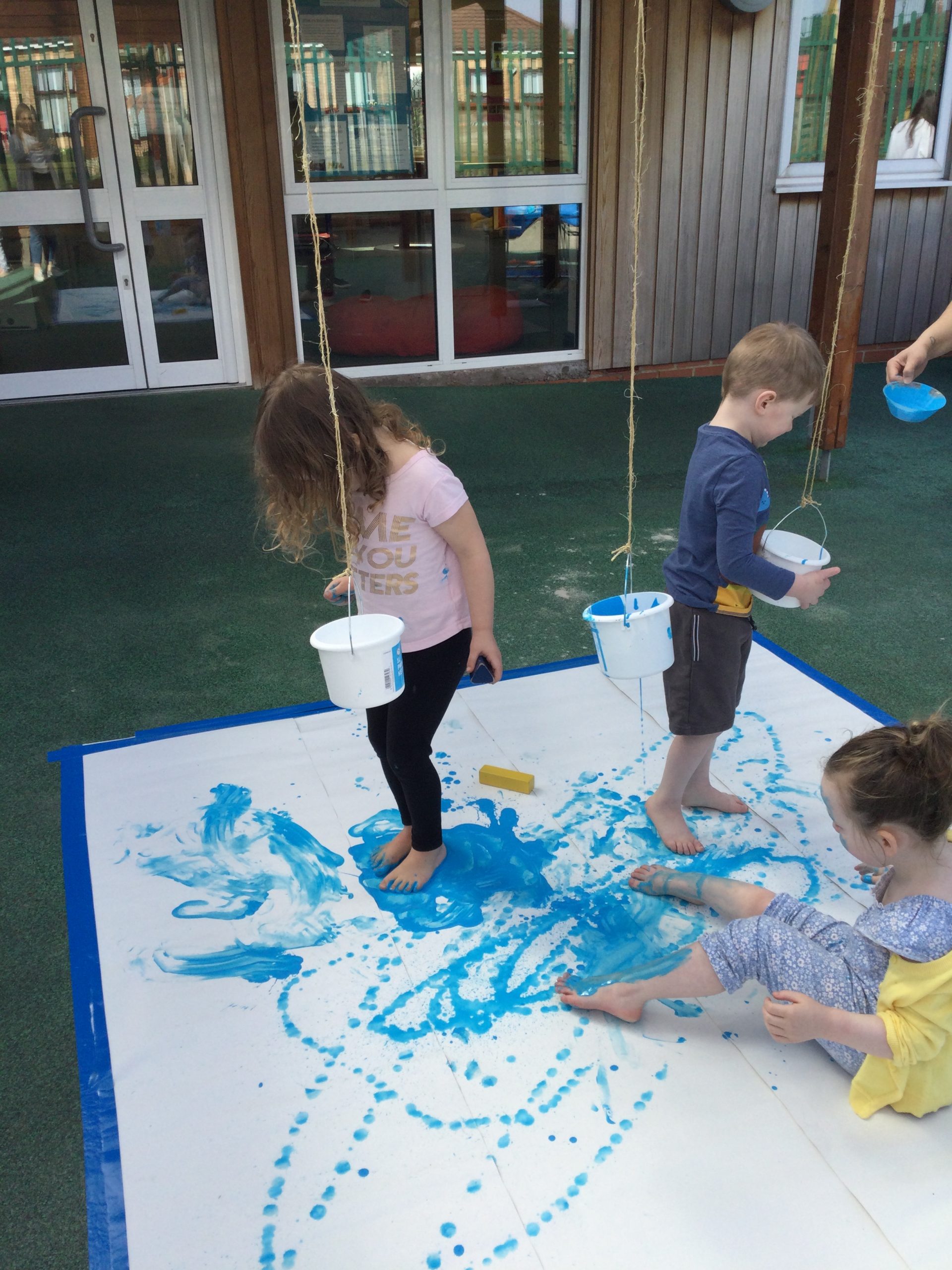 Messy play with blue paint